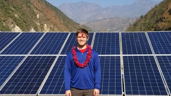 Graham Granger Photo in Front of Solar Panels - Homestay Hospitality in a Nepali Village - College of Natural Resources at NC State University