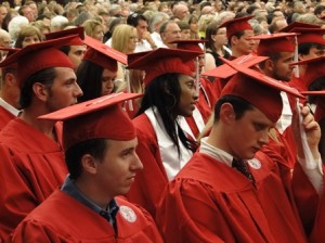 graduates listen to commencement address