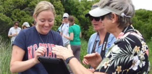 An NC State PRTM Graduate student works with volunteers